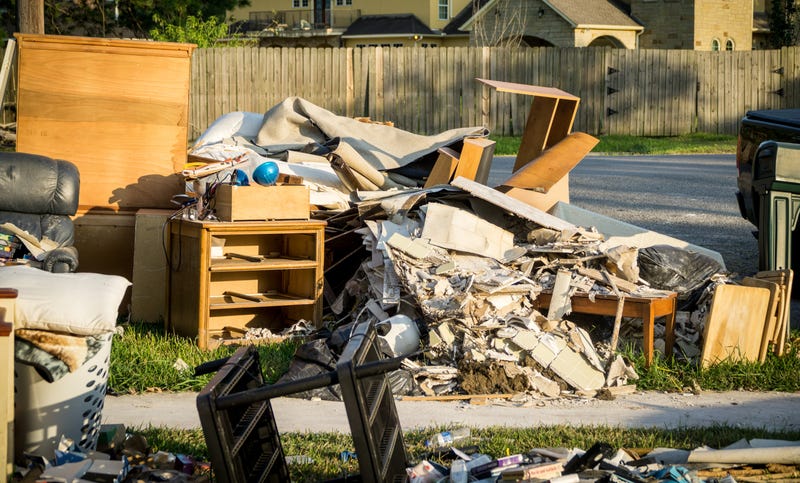 Damaged property piled on curb