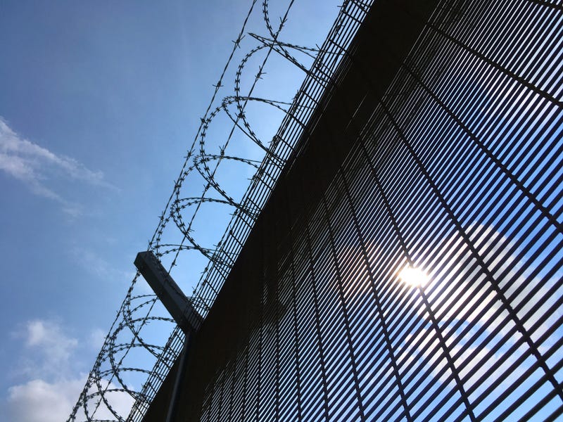 prison fence with barbed wire