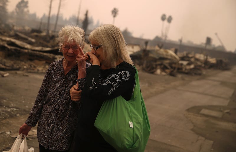 Residents walk through the fire damaged Journey's End Mobile Home Park on October 9, 2017 in Santa Rosa, California.
