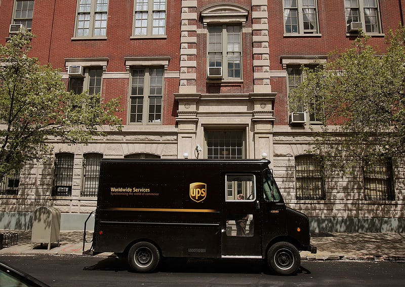 A UPS delivery truck sits parked on a street in Manhattan April 23, 2009 in New York City. United Parcel Service reported first-quarter earnings dropped sharply admist the global economic downturn and a dwindling shipping demand.