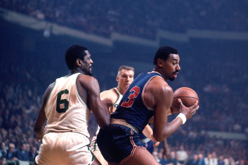 Wilt Chamberlain of the Philadelphia 76ers (right) guarded by Bill Russell of the Boston Celtics during a game at the Boston Garden during the 1966-67 NBA season.