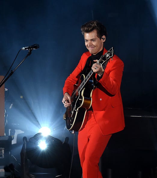 harry styles in red on stage at RADIO.COM's We Can Survive charity concert