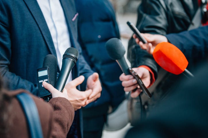 Stock image of reporters.