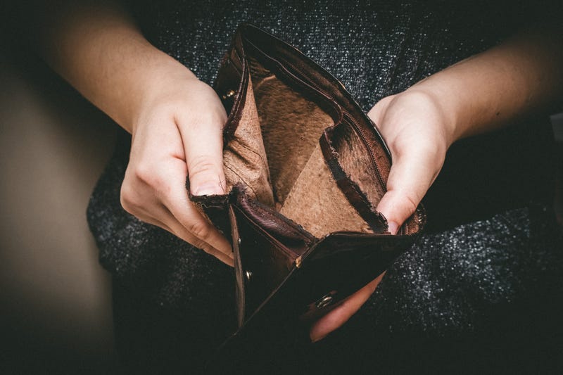 Old empty wallet in the hands .Vintage empty purse in hands of women.