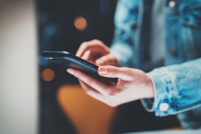 woman holding phone