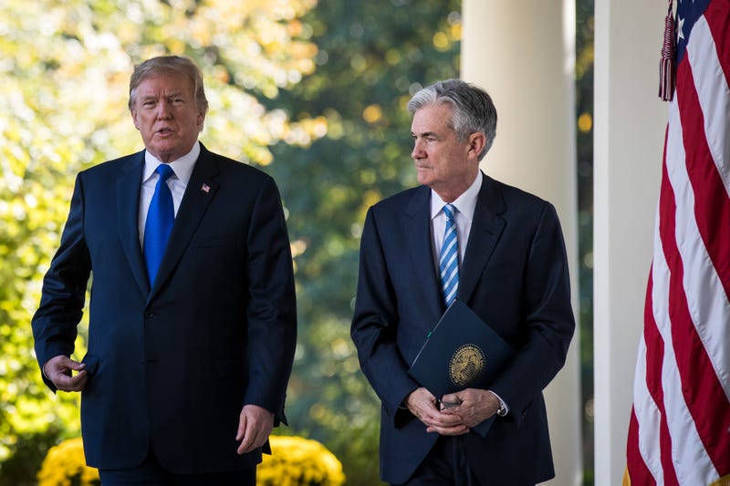 (L to R) U.S. President Donald Trump walks with Federal Reserve Jerome Powell. Trump has been pressuring the Fed to drop interest rates, something they appear unwilling to do because of economic uncertainty caused by Trump's tariff implementation.