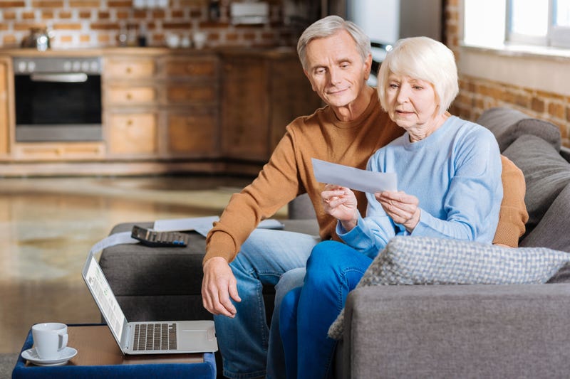 Couple researches social security stock photo.