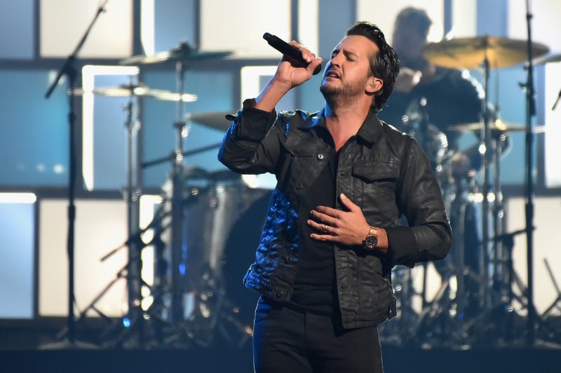 luke bryan sings onstage