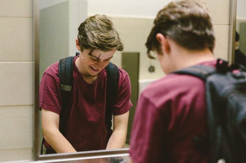 Student uses bathroom