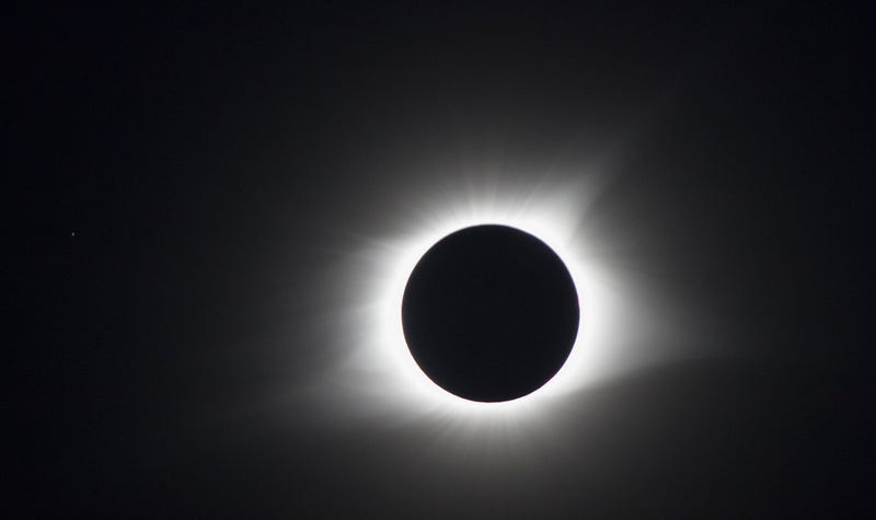 The moon blocks the sun but the sun's corona goes around the moon during a total solar eclipse's transit across the United States, August 21, 2017 in Hopkinsville, Kentucky. 