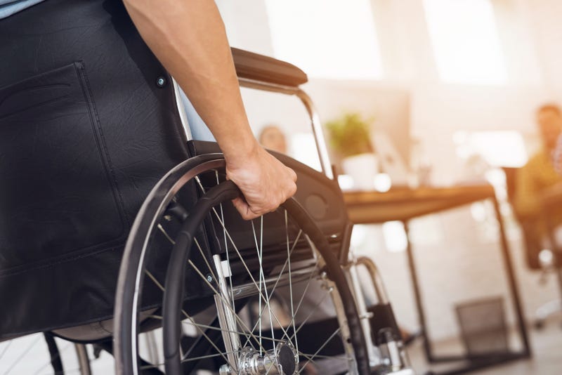 Close-up of a man's hand gripping his wheelchair