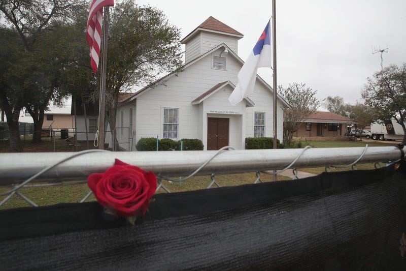 A rose is left in the fence surrounding the First Baptist Church of Sutherland Springs on November 12, 2017, in Sutherland Springs, Texas.