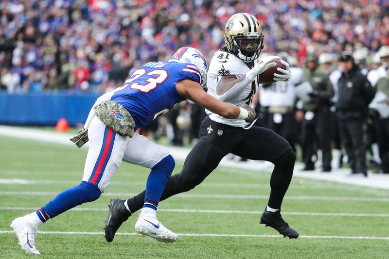 Micah Hyde and Alvin Kamara