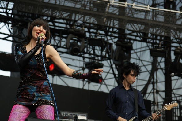 Karen O (L) and Nick Zinner (R) of the Yeah Yeah Yeahs perform at the KROQ Weenie Roast Y Fiesta 2009 at Verizon Wireless Amphitheater on May 16, 2009 in Irvine, California.