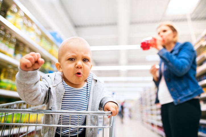 An angry baby at the grocery store. 