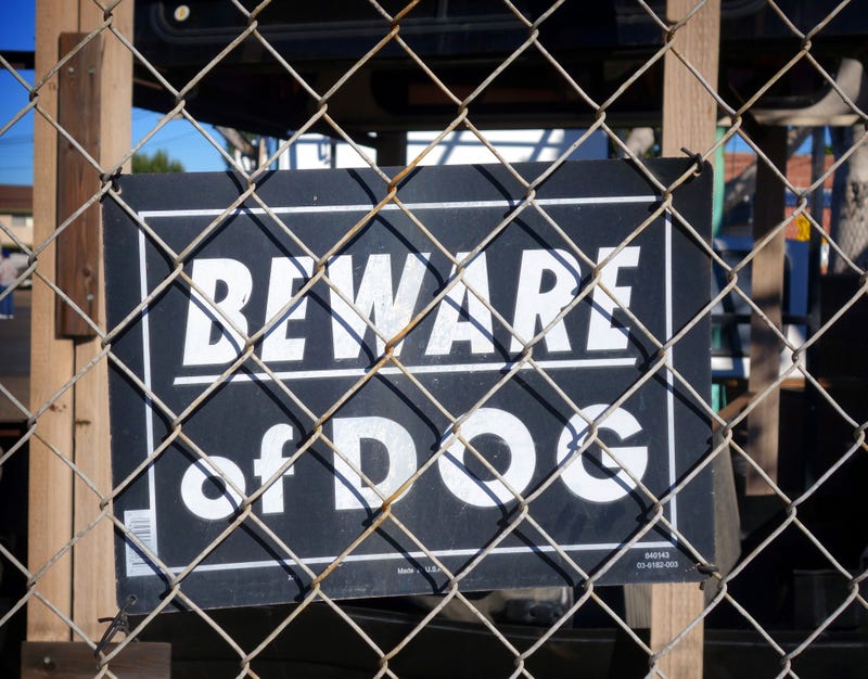 Beware of dog sign.