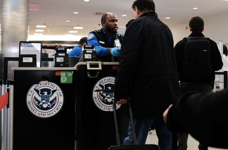 A Transportation Security Administration (TSA) worker screens passengers at LaGuardia Airport (LGA) on the day before Thanksgiving, the nation's busiest travel day on November 22, 2017 in New York City.