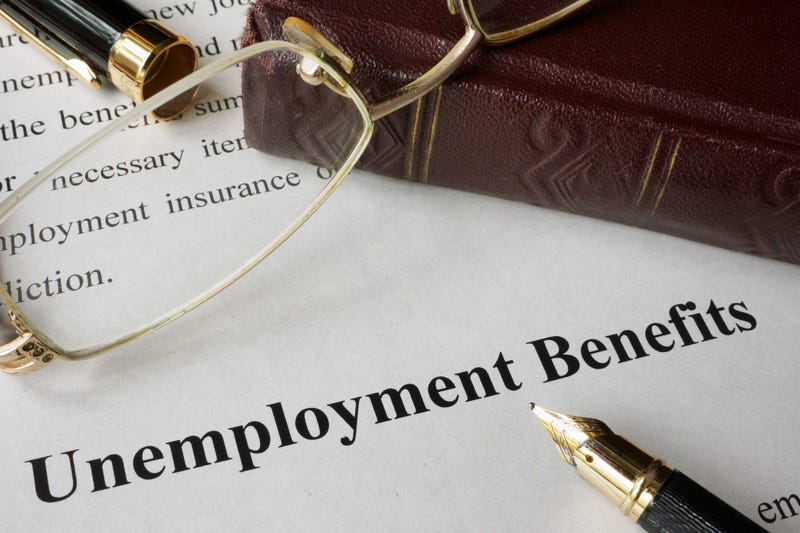 Unemployment Benefits concept written on a paper.