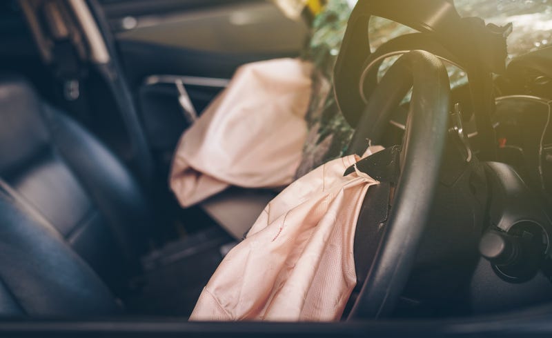 Airbags deployed during a car crash.
