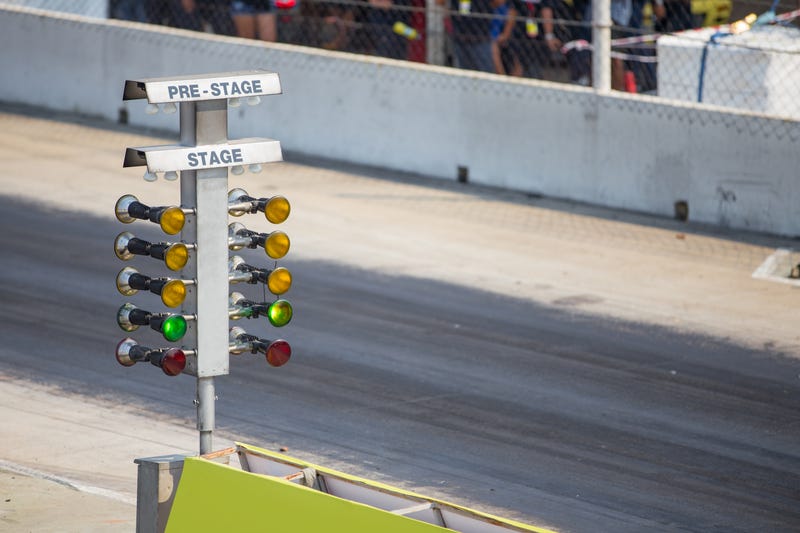 Drag race stage lamp next to track