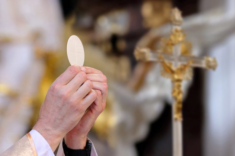 Priest celebrates mass