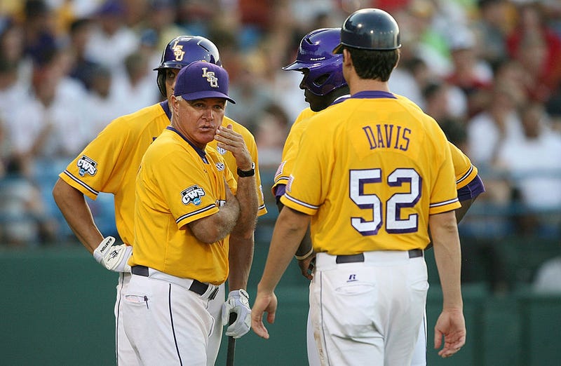 Manager Paul Mainieri of the Louisiana State University Tigers looks on as he has a meeting with his players in the sixth inning during Game 3 of the 2009 NCAA College World Series at Rosenblatt Stadium on June 24, 2009 in Omaha, Nebraska.