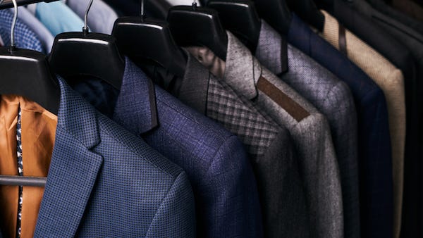 Office employees wearing designer labels less likely to be seen as “team players”