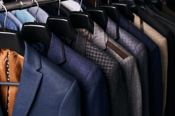 Mens suits hanging on hangers