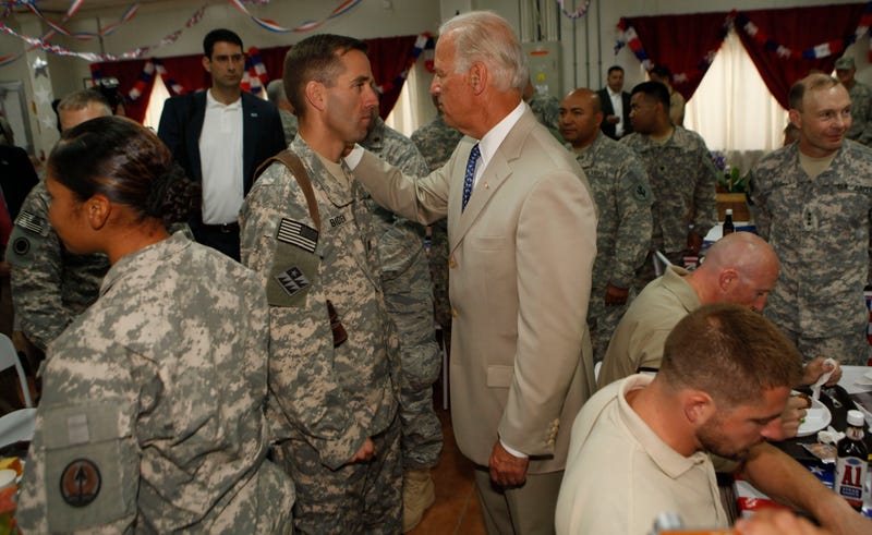 U.S. Vice President Joe Biden talks with his son U.S. Army Capt. Beau Biden (L) at Camp Victory on July 4, 2009 near Baghdad, Iraq. Bidden's first visit to Iraq as the Vice President comes days after U.S. forces pulled out from Iraq's cities.