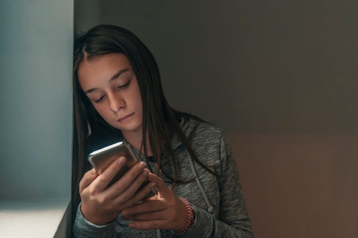 teen using phone
