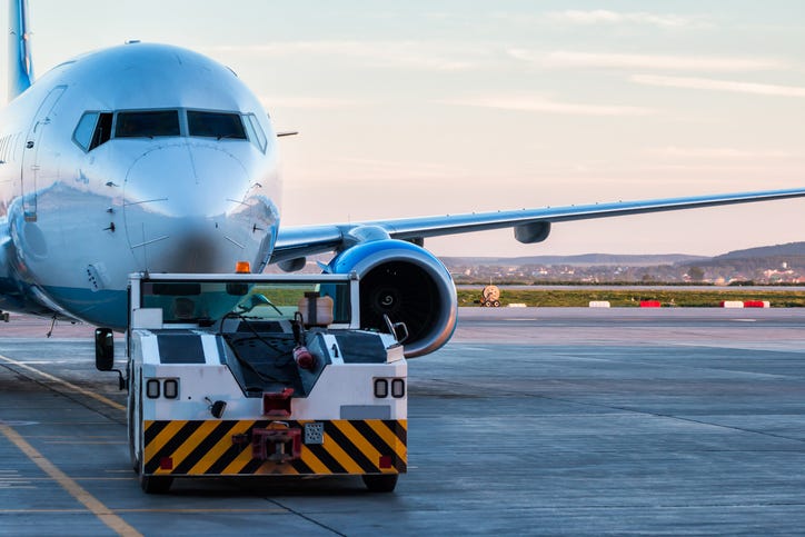 Plane being towed.
