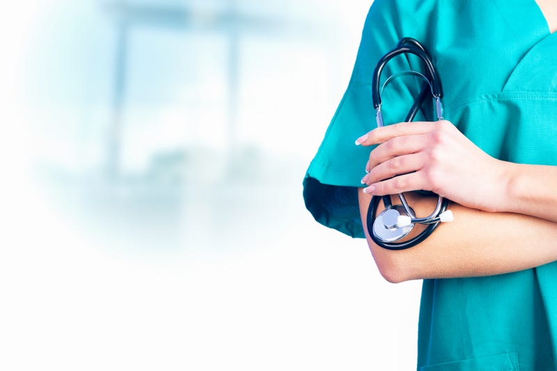 Nurse holding a stethoscope in her hand.