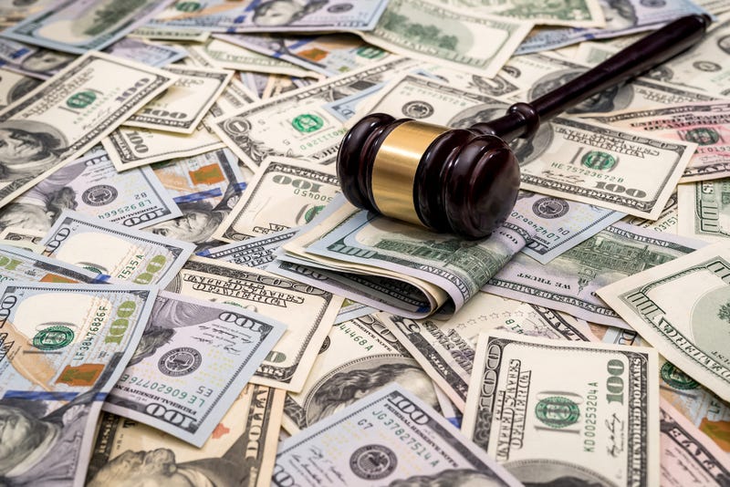 Gavel on top of pile of money
