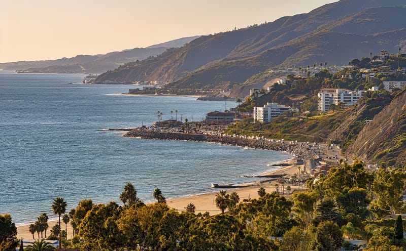 High angle view of Southern California coast and beach with Santa Monica mountains in the background.