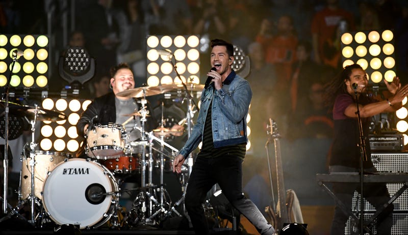 Andy Grammer performs on stage.
