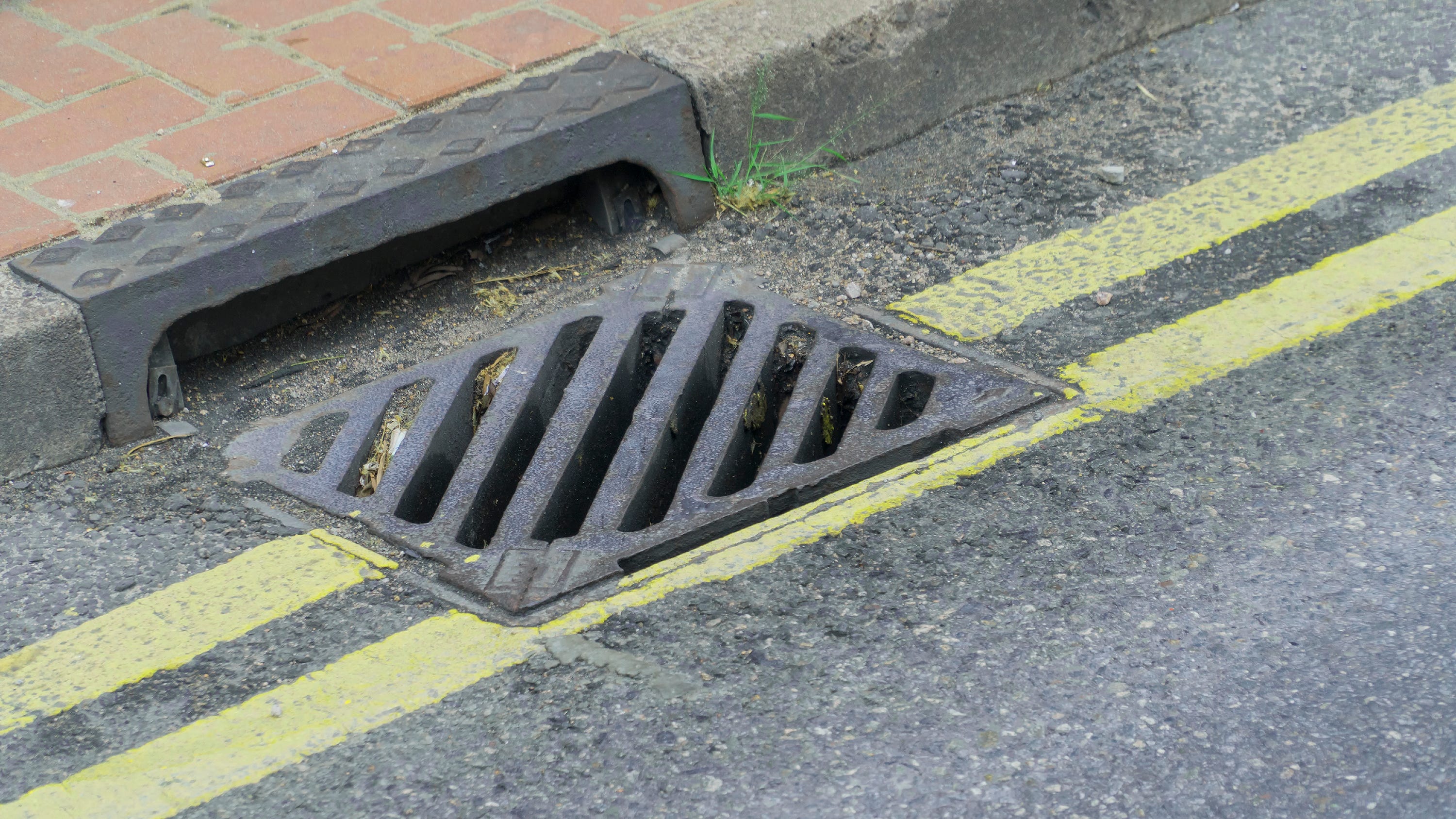 Storm drains stolen across a city, leaving gaping holes over 15-foot drops