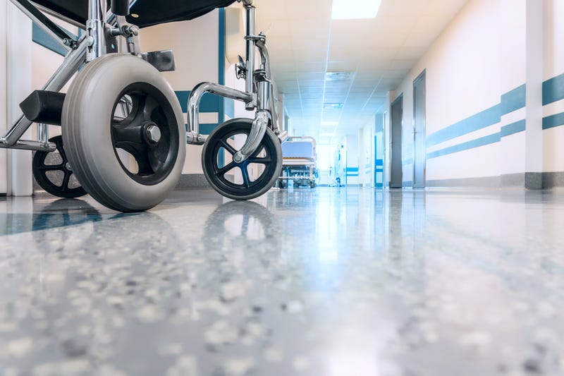 Wheelchair shown in hospital hallway