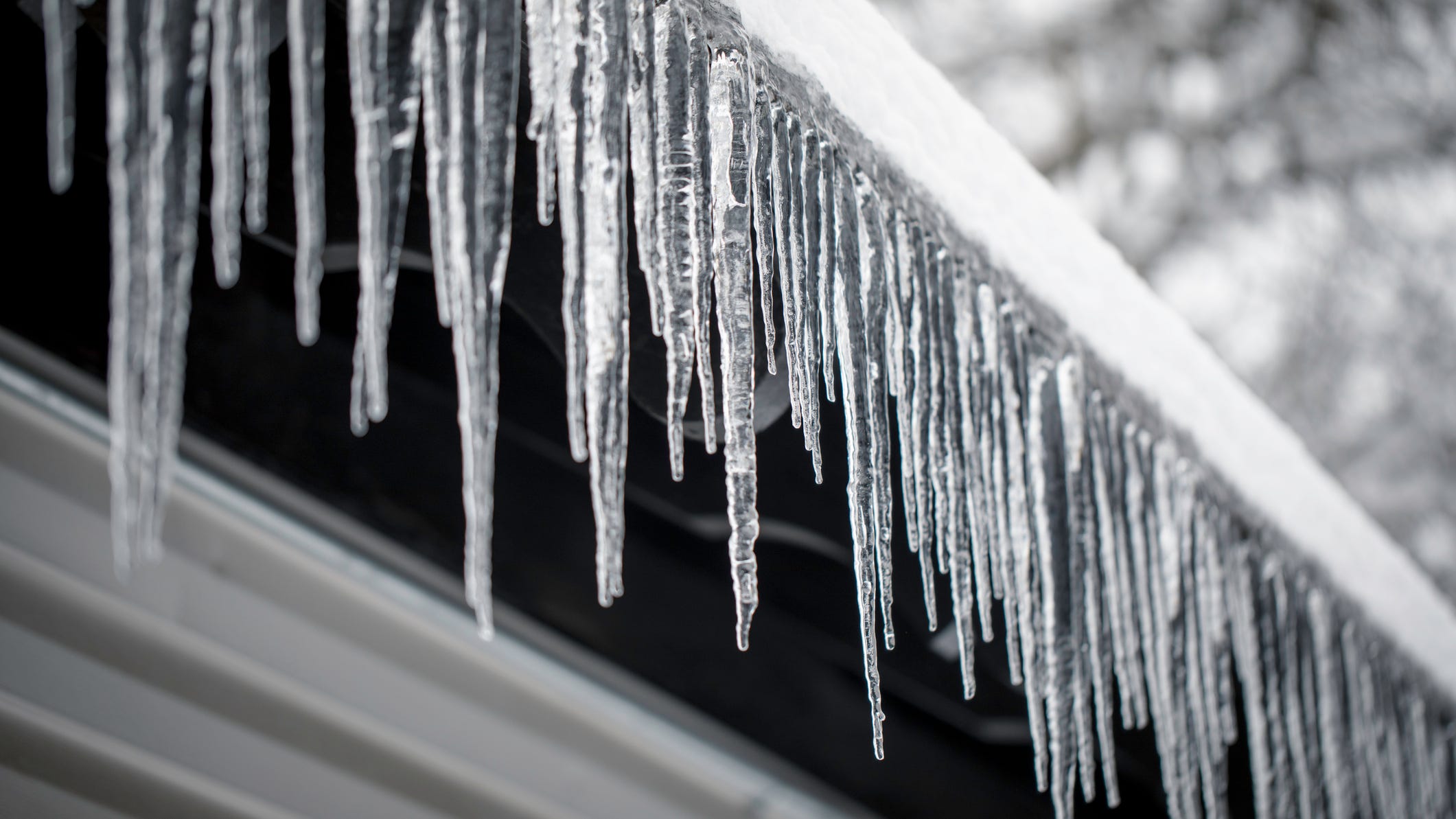 Southlake firefighters clear dangerous icicles from the eaves of Town Hall