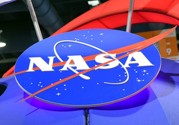 The NASA logo is displayed at the agency's booth during CES 2018 at the Las Vegas Convention Center on January 11, 2018 in Las Vegas, Nevada.