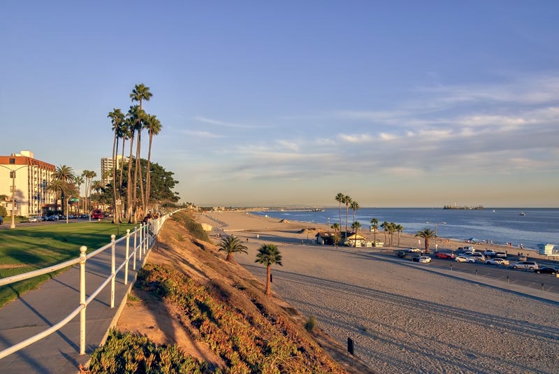 FILE - View of coastal Long Beach at sunset, with sandy beaches and the blue Pacific ocean.