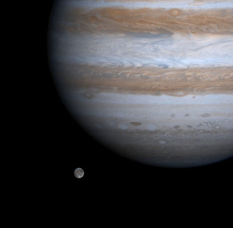 The solar system's largest moon, Ganymede, is captured here alongside the planet Jupiter in this picture taken by NASA's Cassini spacecraft, December 3, 2000.