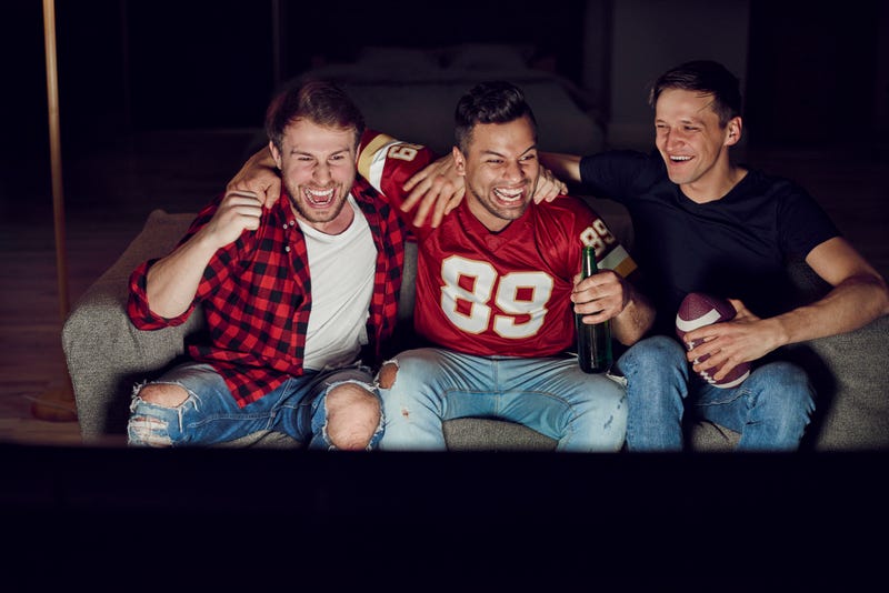 friends watching football