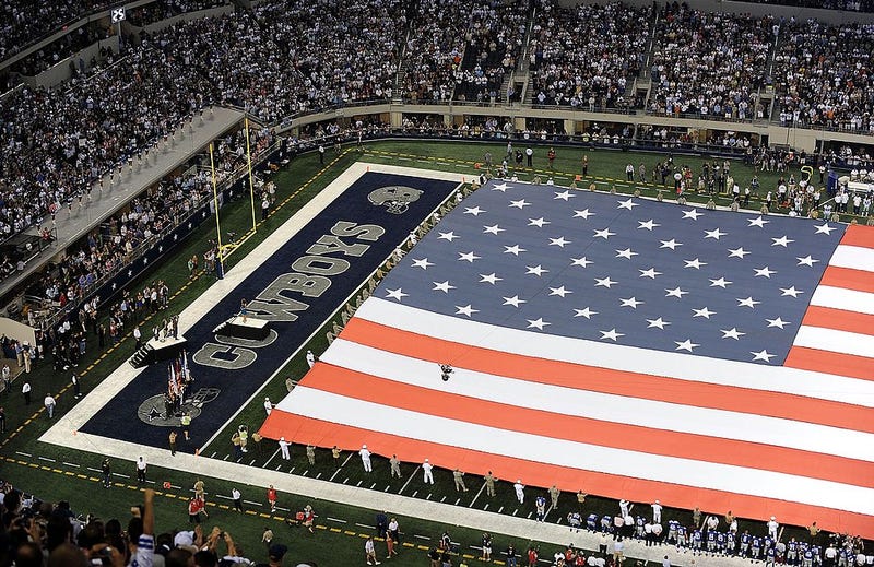 he American flag on the field during the national anthem before a game between the New York Giants and the Dallas Cowboys at Cowboys Stadium on September 20, 2009 in Arlington, Texas.