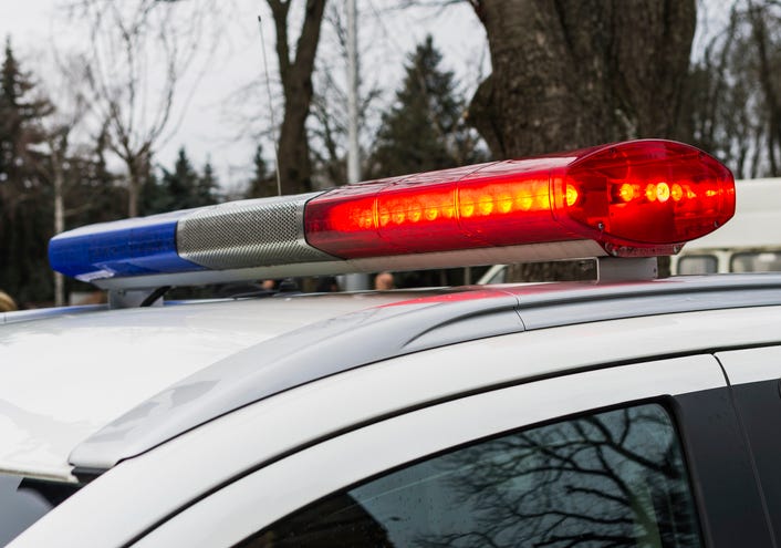 Close up picture of the flashing lights on top of a police car. 