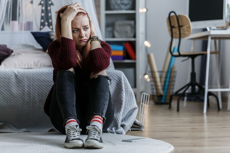 Worried girl holding head