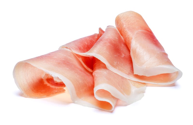 Italian prosciutto crudo or spanish jamon. Raw ham. Isolated on white background.