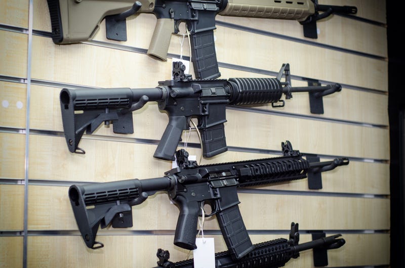 Assault-style guns on a wall