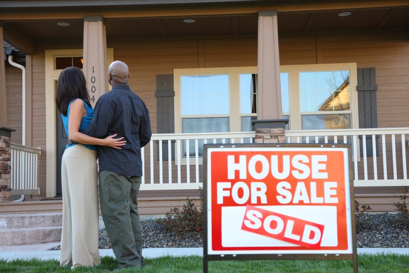 Couple looks at newly-purchased home