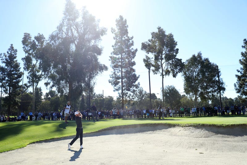 golfer hitting a golf ball