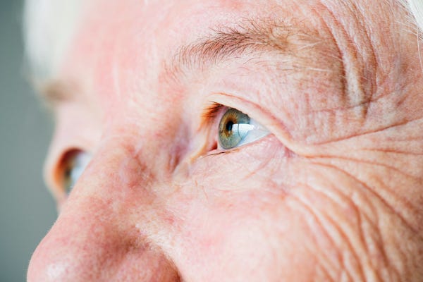 Closeup side portrait of elderly woman's eyes